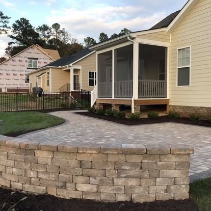 Paver patio with seat wall and fresh sod